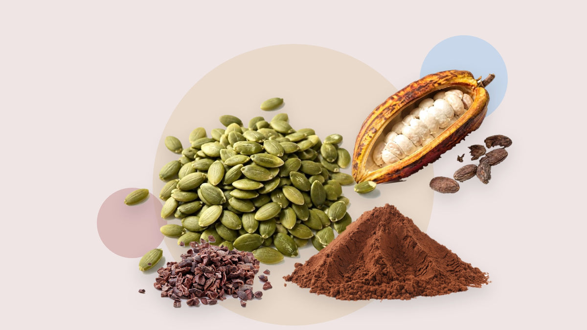 Pumpkin seeds, cacao nibs, a cacao pod and cacao powder, all foods high in magnesium